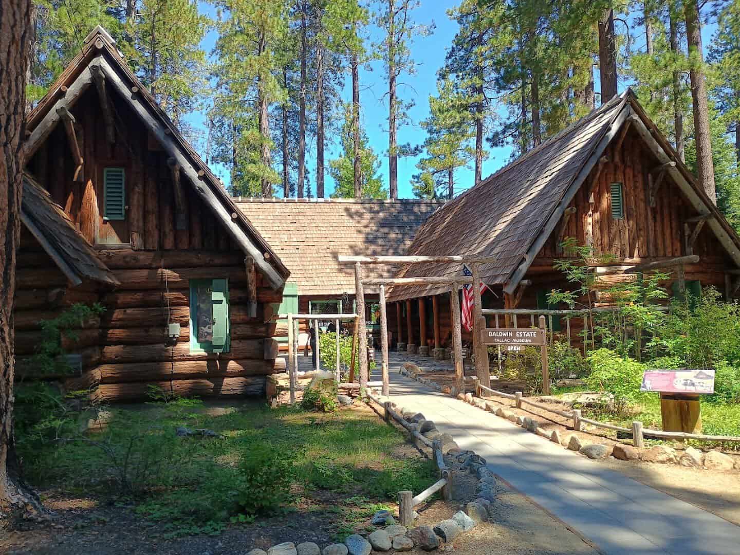 Rustic log cabins among tall pines at Camp Richardson Resort in South Lake Tahoe, California