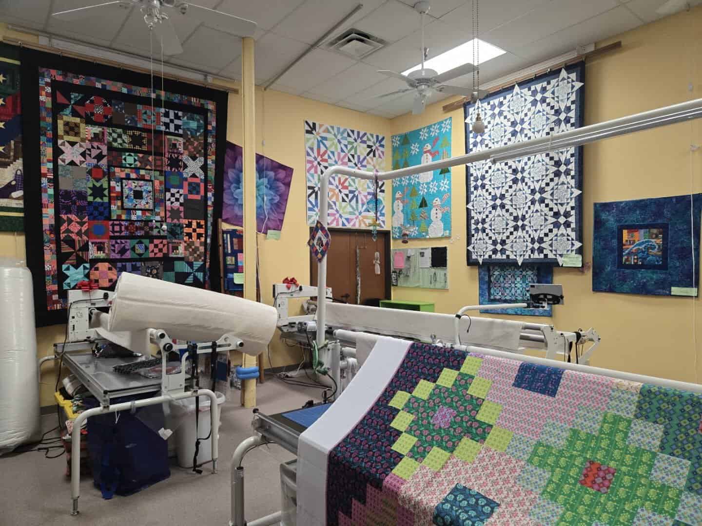 A longarm quilting machine in the APQS studio at Quilt Country in Lewisville, Texas
