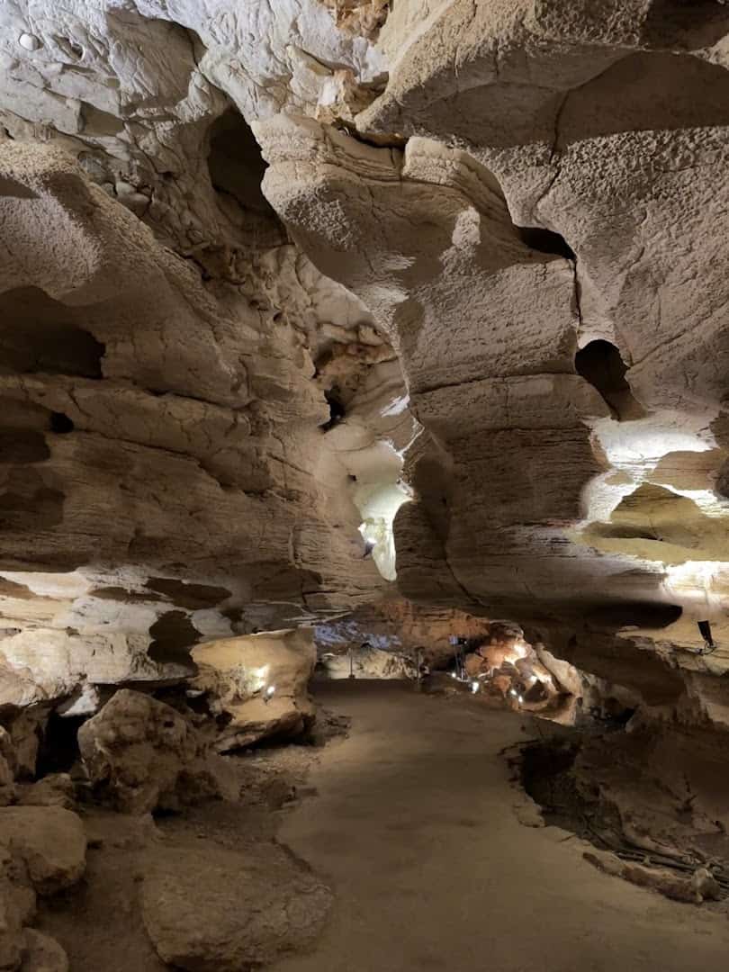 Smooth walls carved by an ancient river inside Longhorn Cavern, Texas