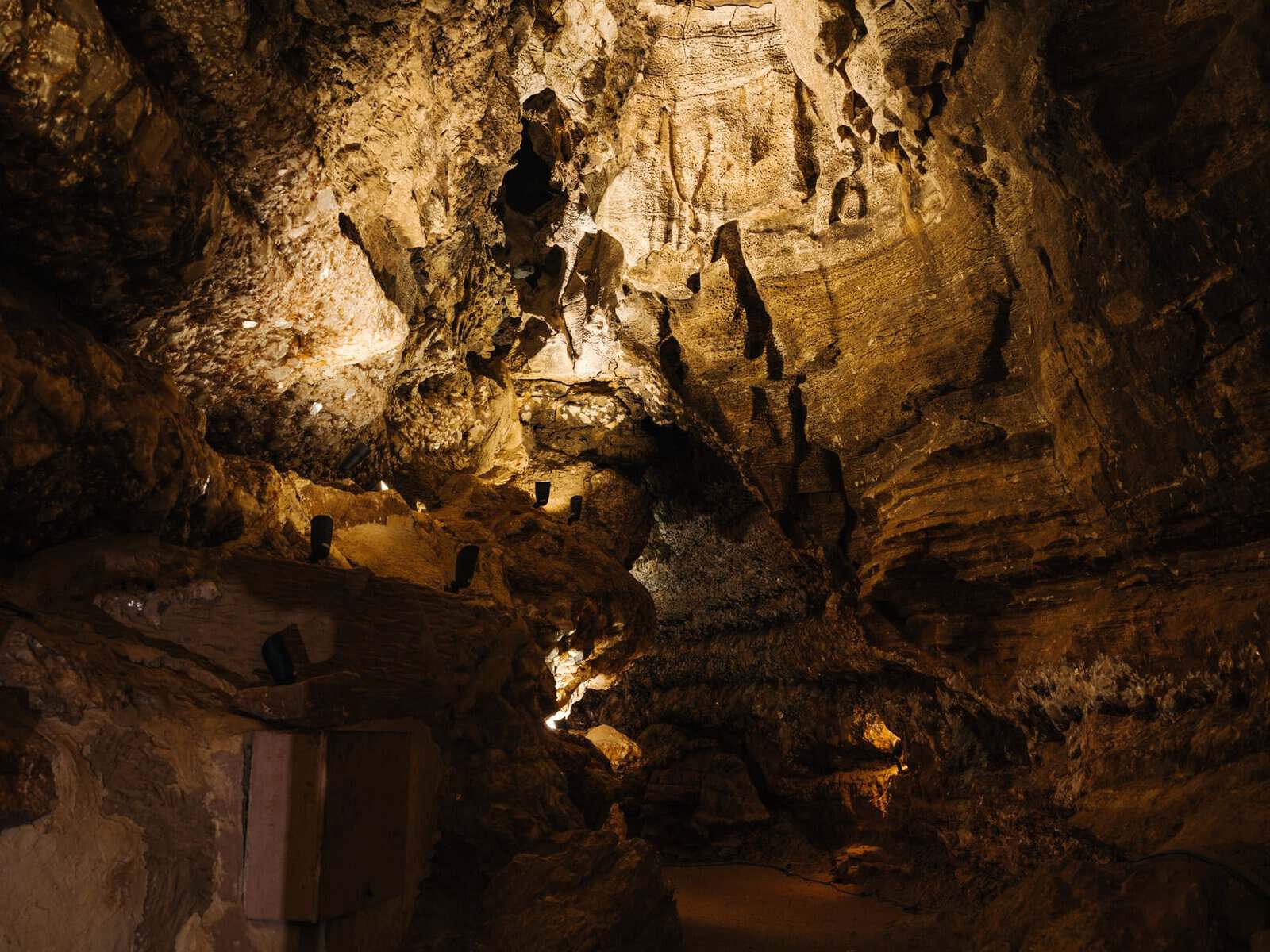 Warm-lit chamber inside Longhorn Cavern State Park in Burnet, Texas