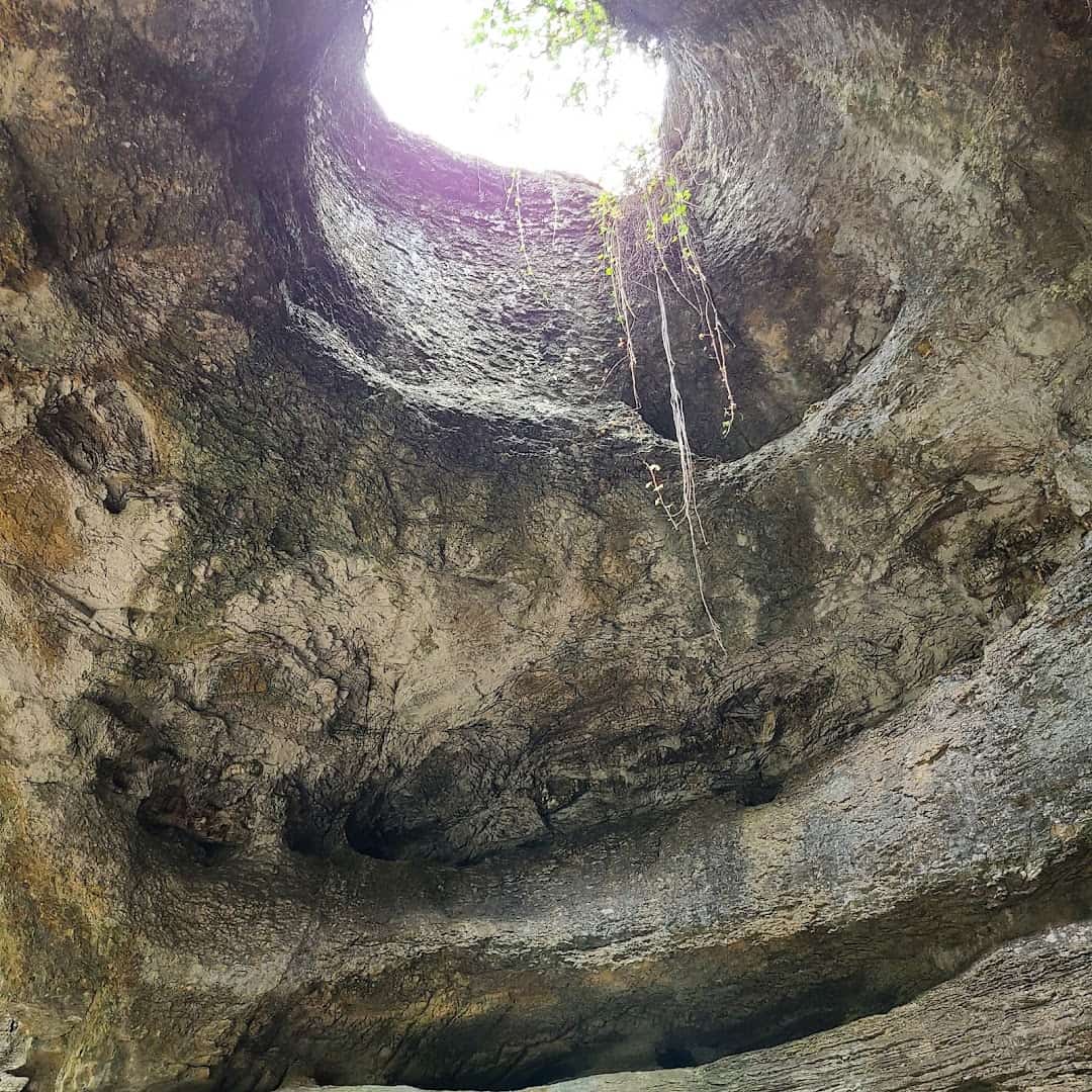 Daylight streaming down a sinkhole shaft into Longhorn Cavern in Burnet, Texas