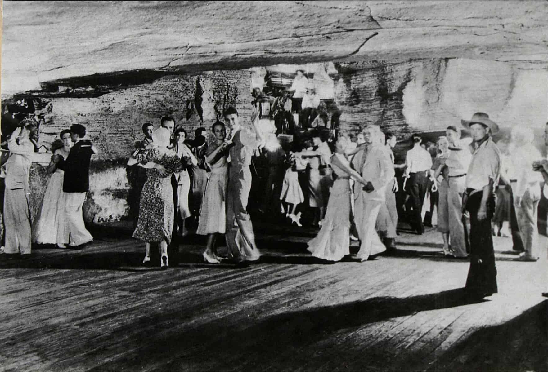 Historic 1930s photo of dancers on the wooden floor of the Underground Ballroom inside Longhorn Cavern