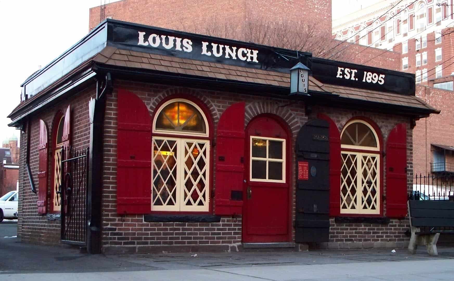 Historic red brick facade of Louis' Lunch in New Haven, Connecticut