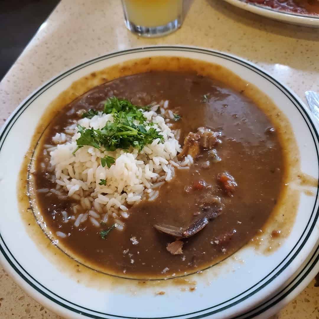 Bowl of Louisiana Creole gumbo over rice at Gumbo Shop in New Orleans
