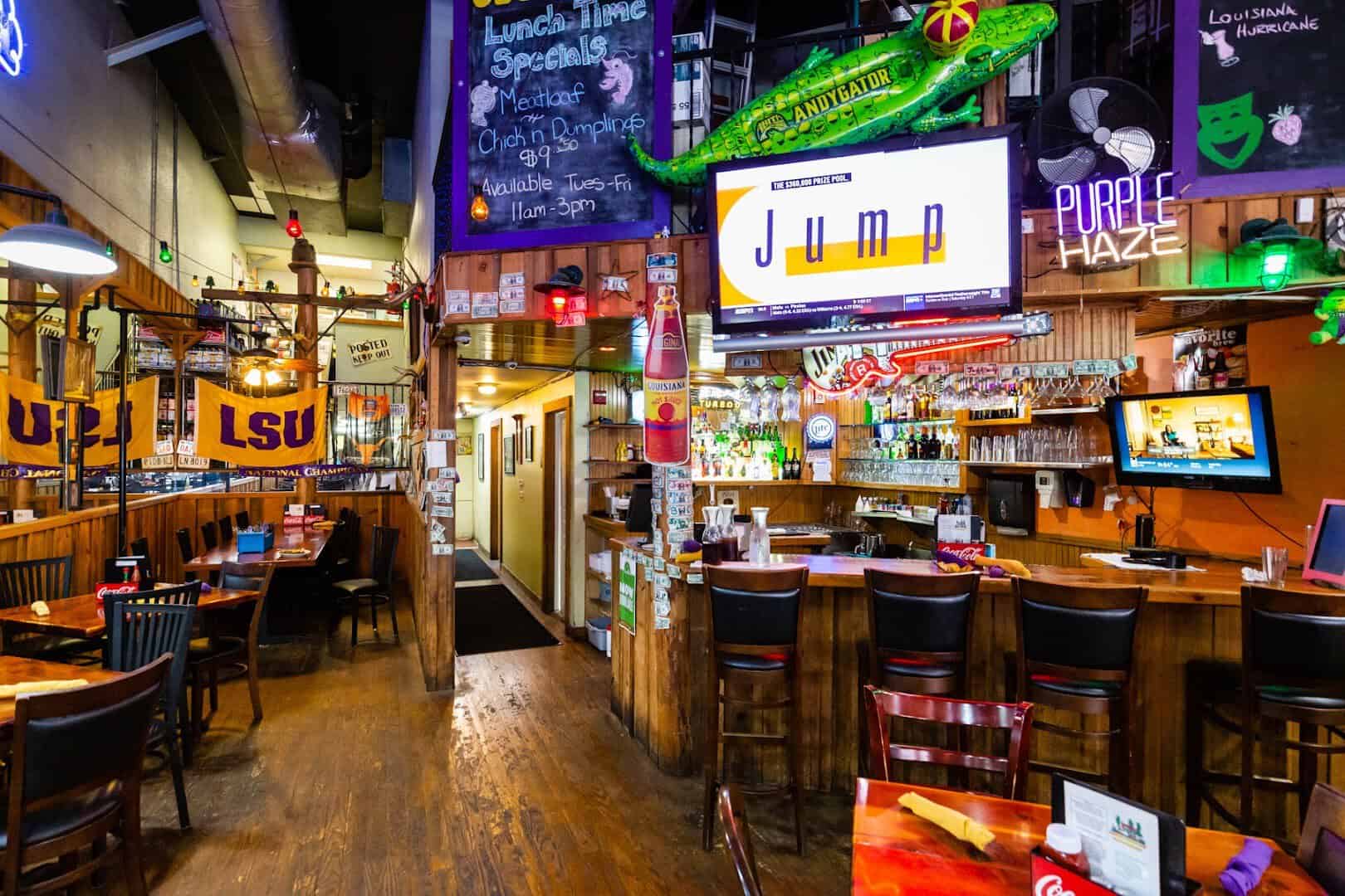 Bayou-themed bar and dining room with LSU banners at Louisiana Longhorn Cafe in Round Rock