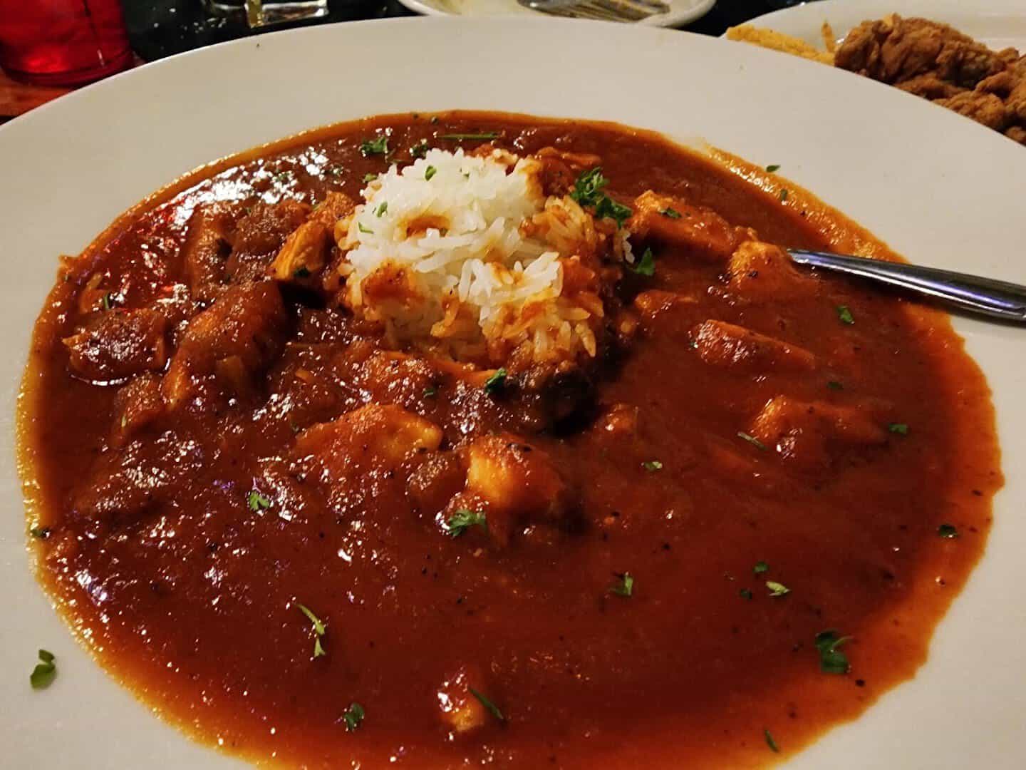 Crawfish etouffee over a mound of rice at Louisiana Longhorn Cafe in Round Rock, Texas