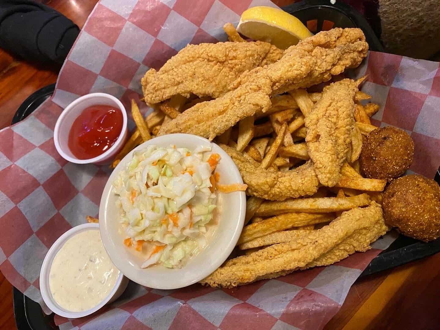 Fried catfish basket with fries, hush puppies and coleslaw at Louisiana Longhorn Cafe in Round Rock, Texas