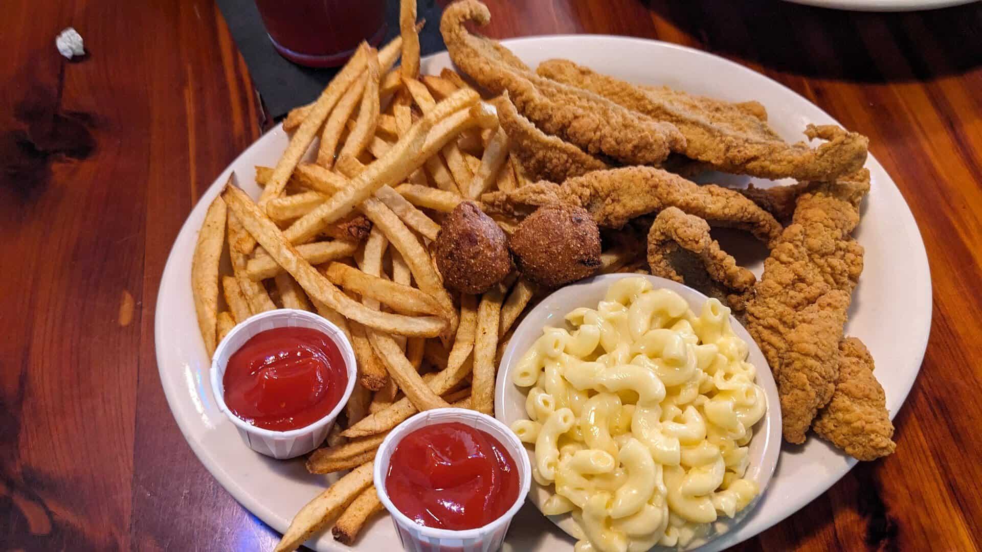 Fried catfish basket with fries, hush puppies and mac and cheese at Louisiana Longhorn Cafe