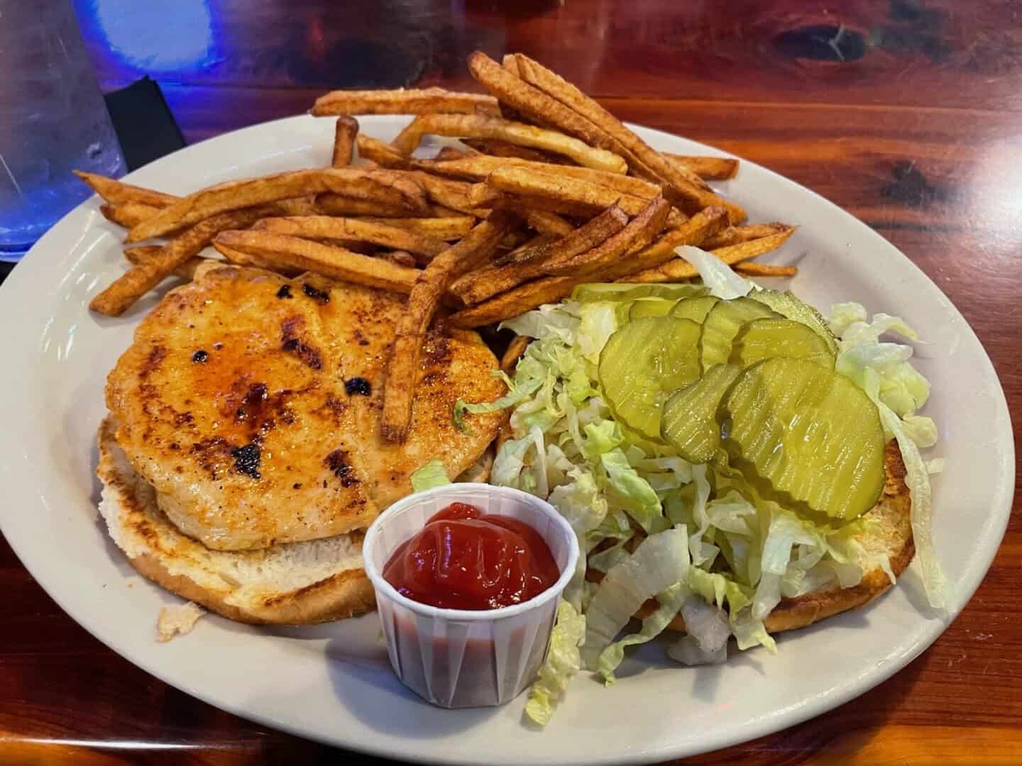 Fried seafood basket with fries and coleslaw at Louisiana Longhorn Cafe in Round Rock, Texas