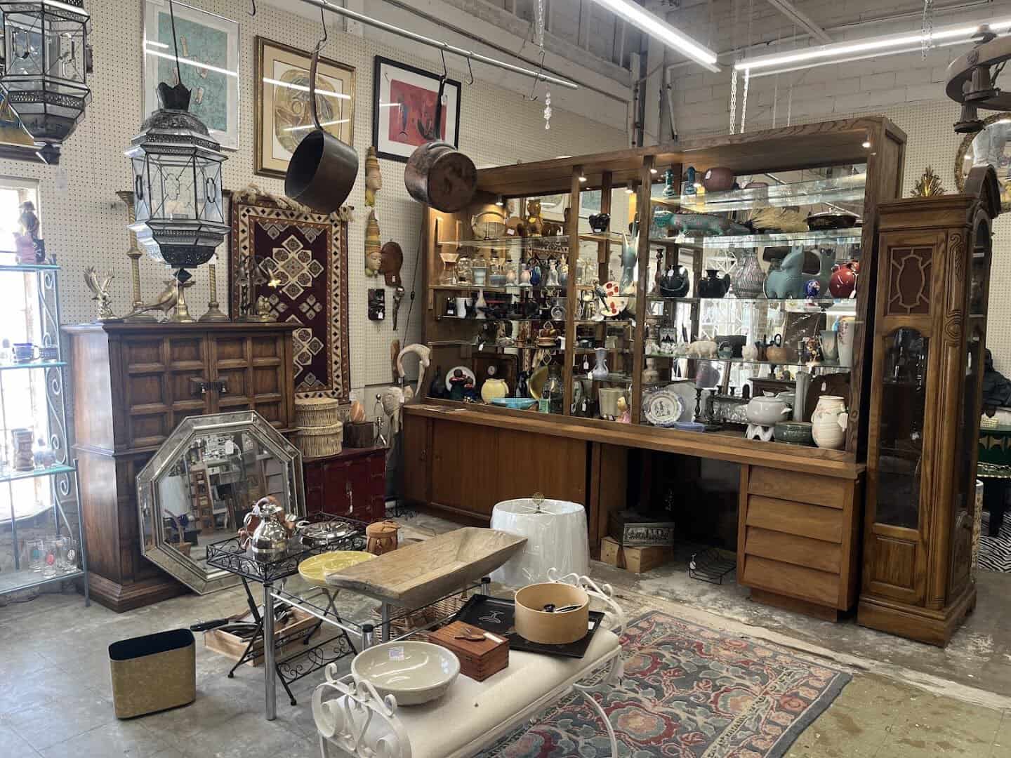 Glass display cases and vendor booths inside Lula B's Design District in Dallas
