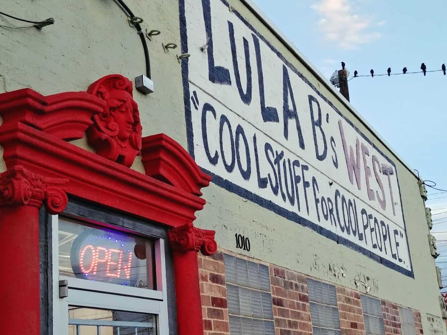 The red front door and Cool Stuff for Cool People sign at Lula B's in Dallas
