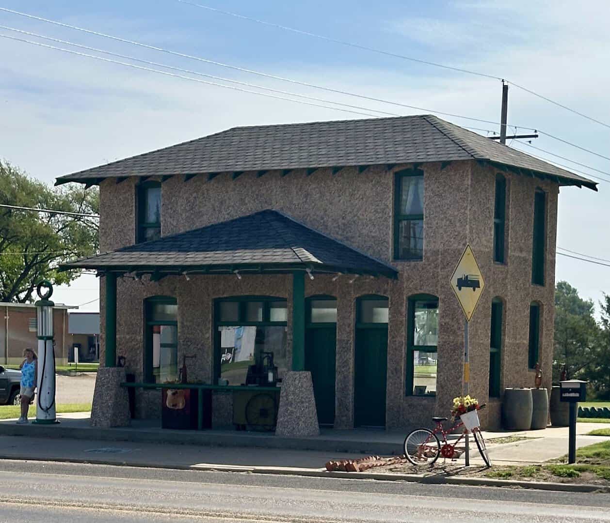 The restored two-story Magnolia Station on Route 66 in Vega, Texas
