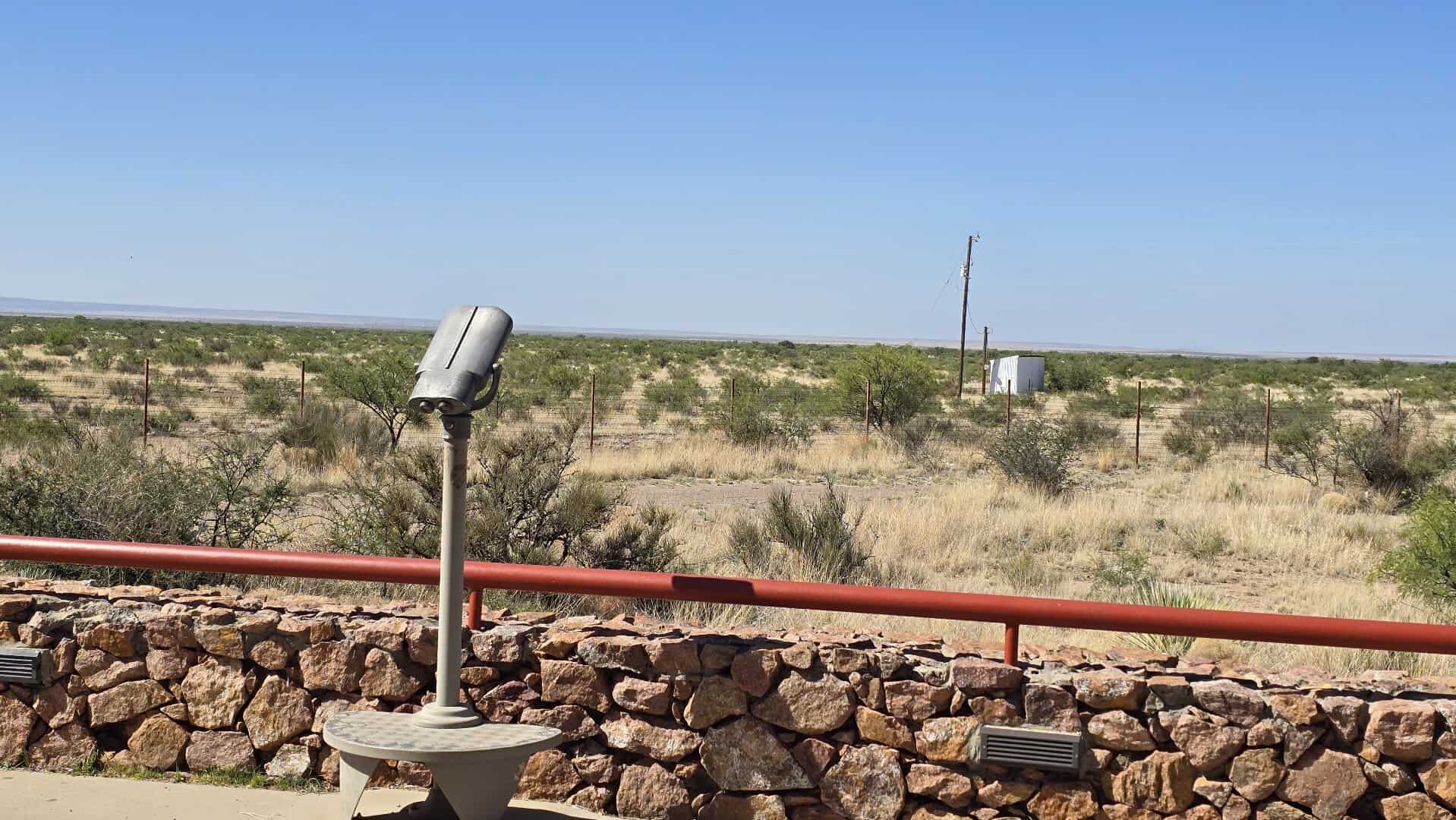 Mounted viewing binoculars and stone wall overlooking the desert at the Marfa Lights Viewing Area near Marfa, Texas