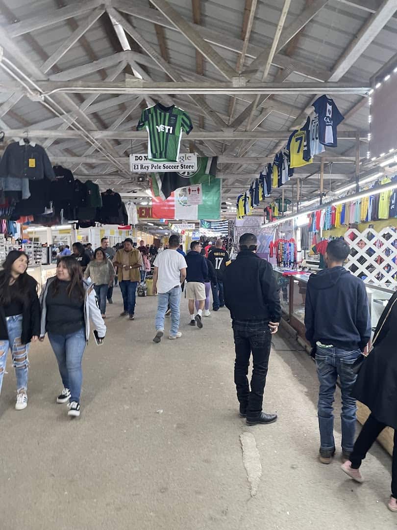 Shoppers browsing the aisles at Austin Country Flea Market