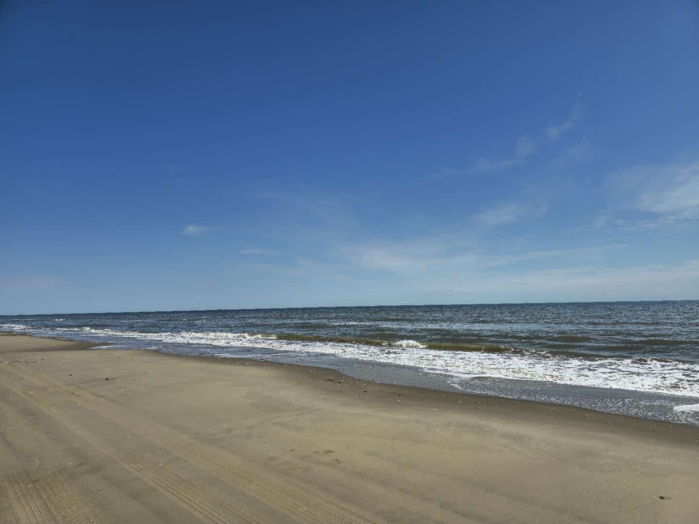Wide empty beach and surf at McFaddin National Wildlife Refuge, Texas
