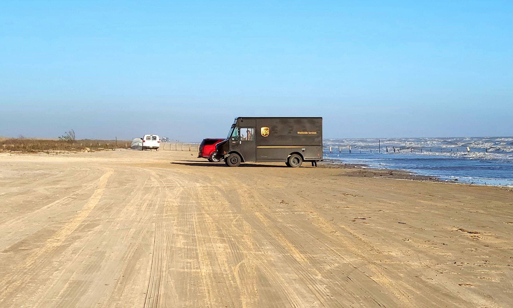 Vehicle on the hard-packed drivable beach at McFaddin National Wildlife Refuge, Texas