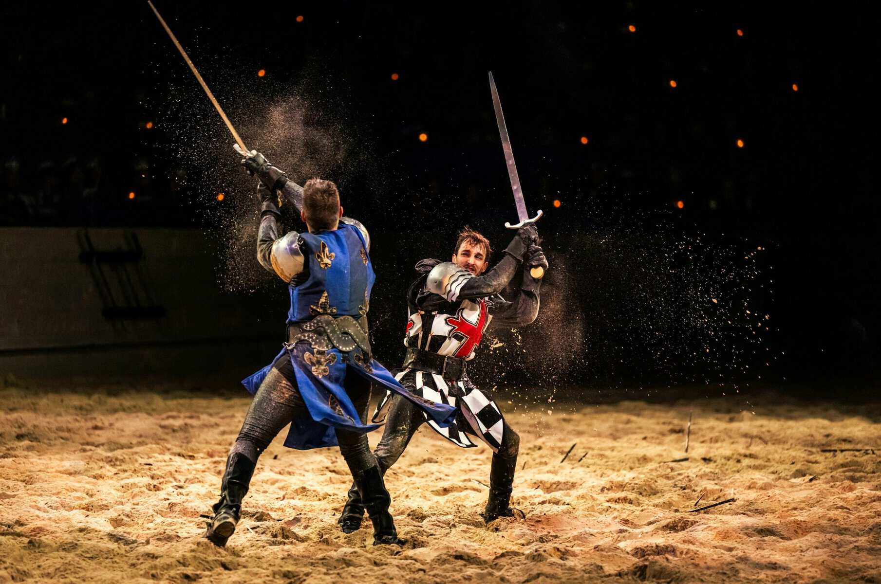 Two armored knights sword fighting at Medieval Times in Lyndhurst, New Jersey