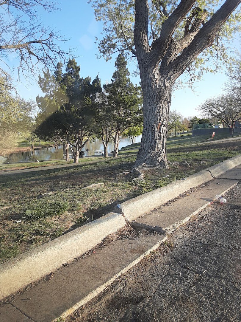 The flat paved Medipark loop trail winding through Medical Center Park in Amarillo, Texas