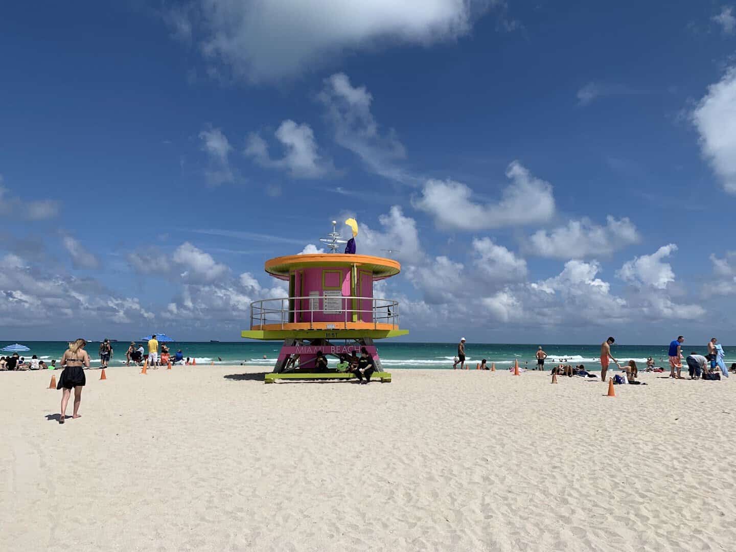 Colorful lifeguard tower on the white sand of South Beach in Miami Beach, Florida