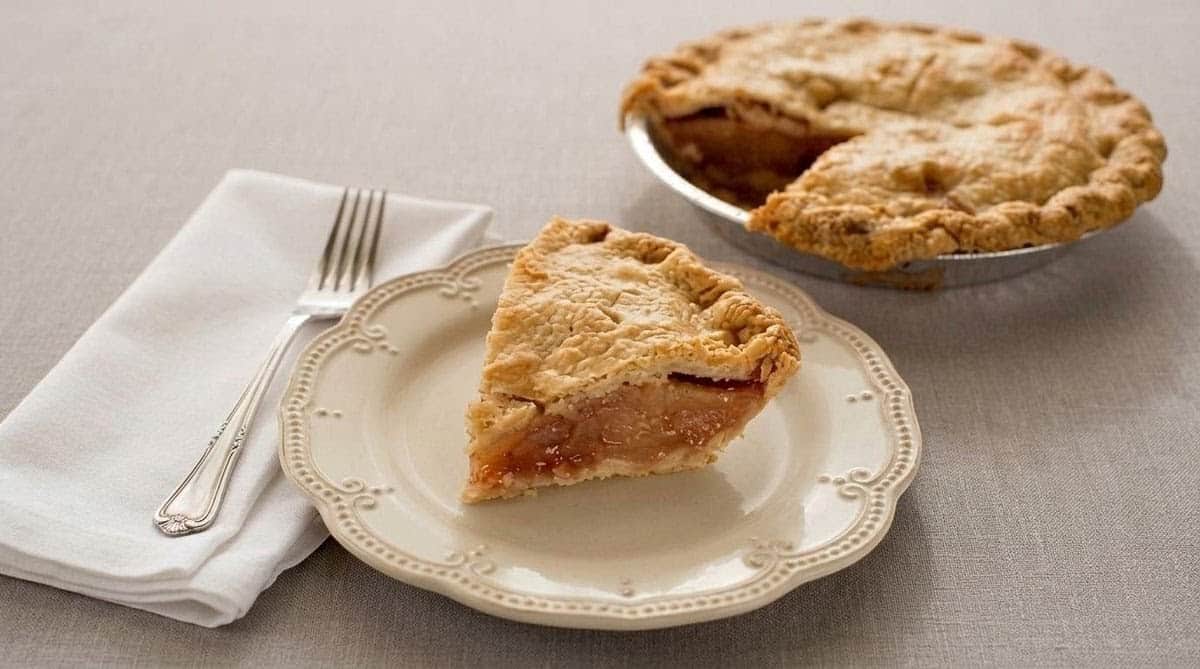 Golden fruit pies and a slice on a plate at a Traverse City, Michigan pie shop