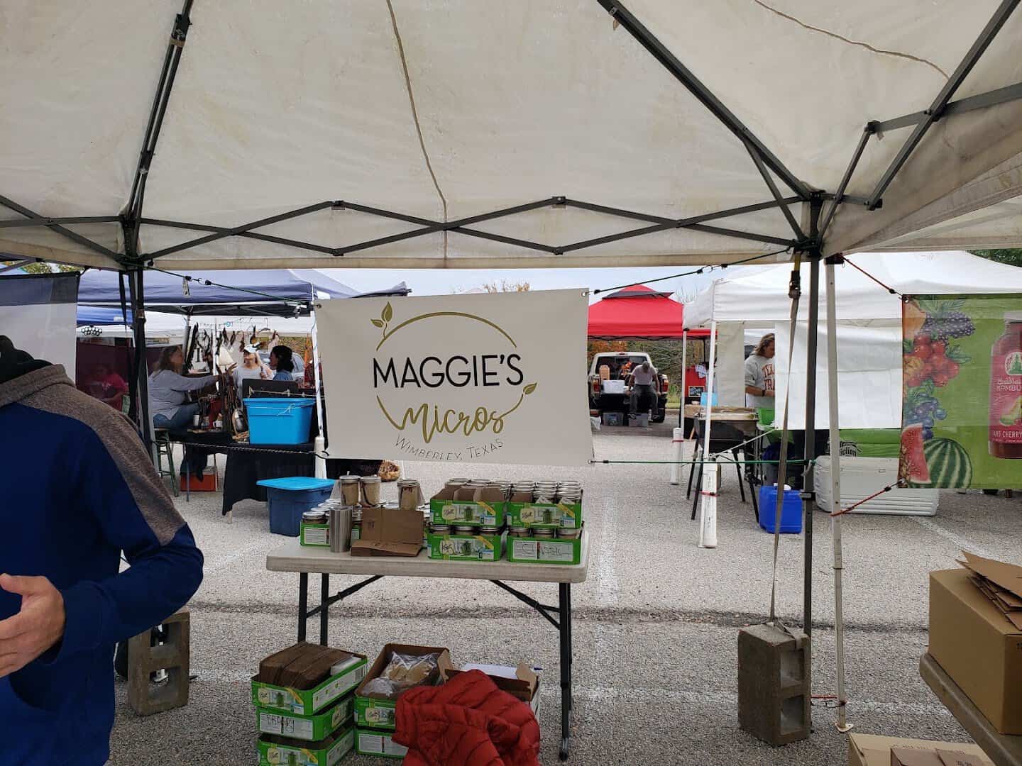 Vendor stall with microgreens and produce at Barton Creek Farmers Market in Austin, Texas
