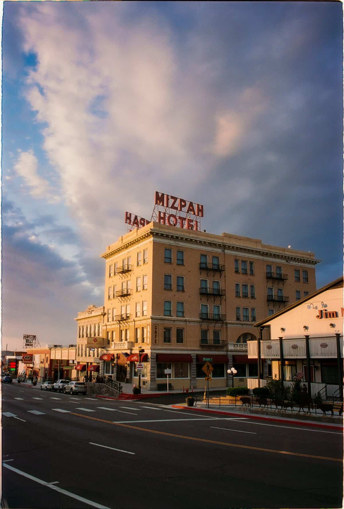The Mizpah Hotel exterior with neon sign at dusk in Tonopah, Nevada