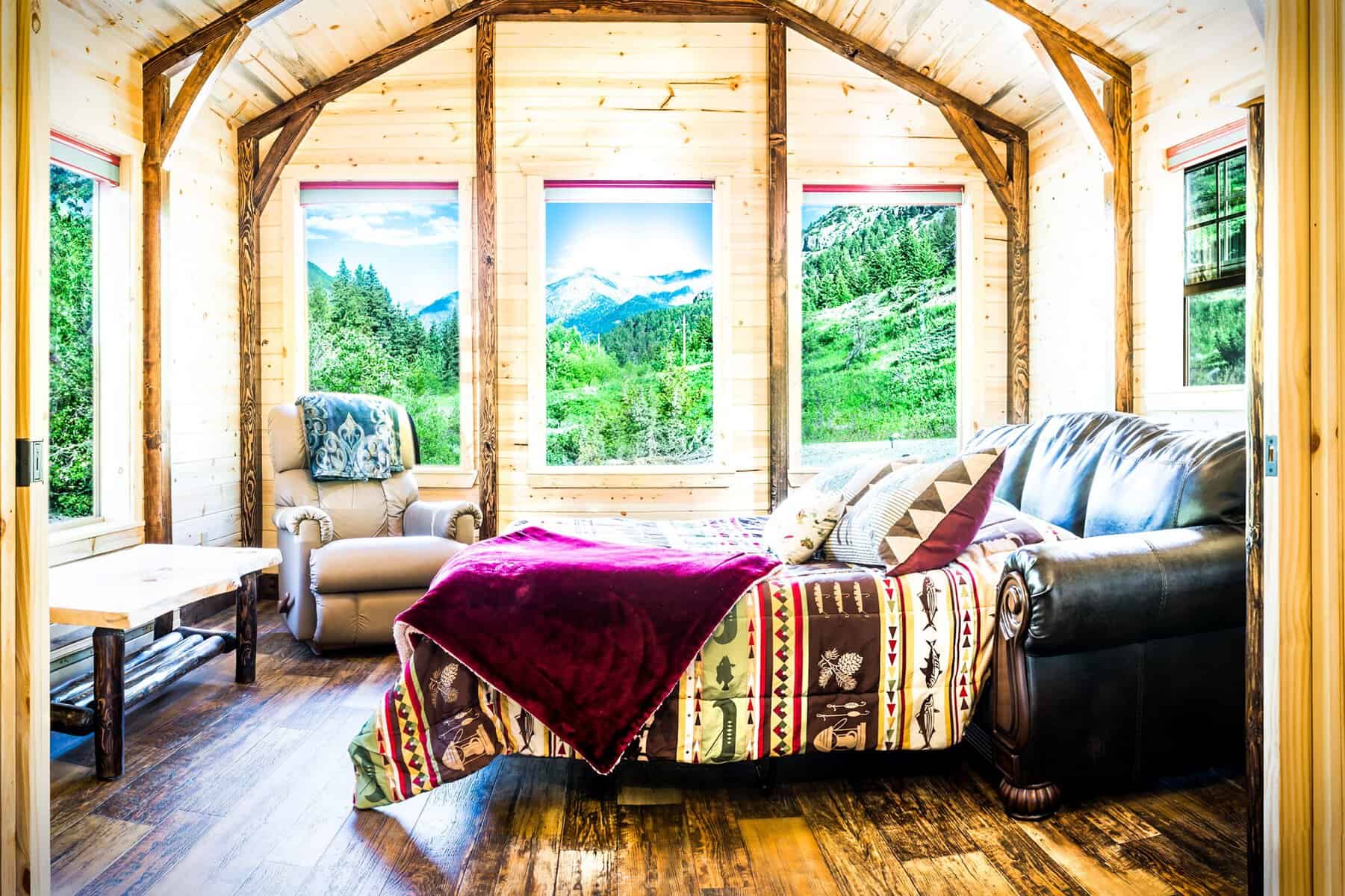 Cozy cabin interior framing snowy mountains at Montana Cabin Rentals near Big Timber, Montana