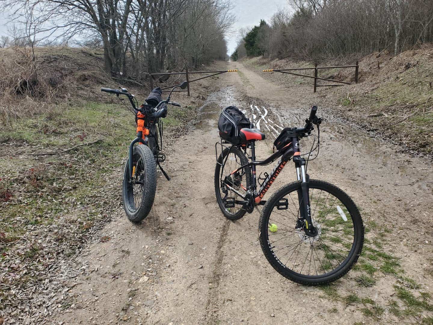 Two mountain bikes parked on the gravel Northeast Texas Trail