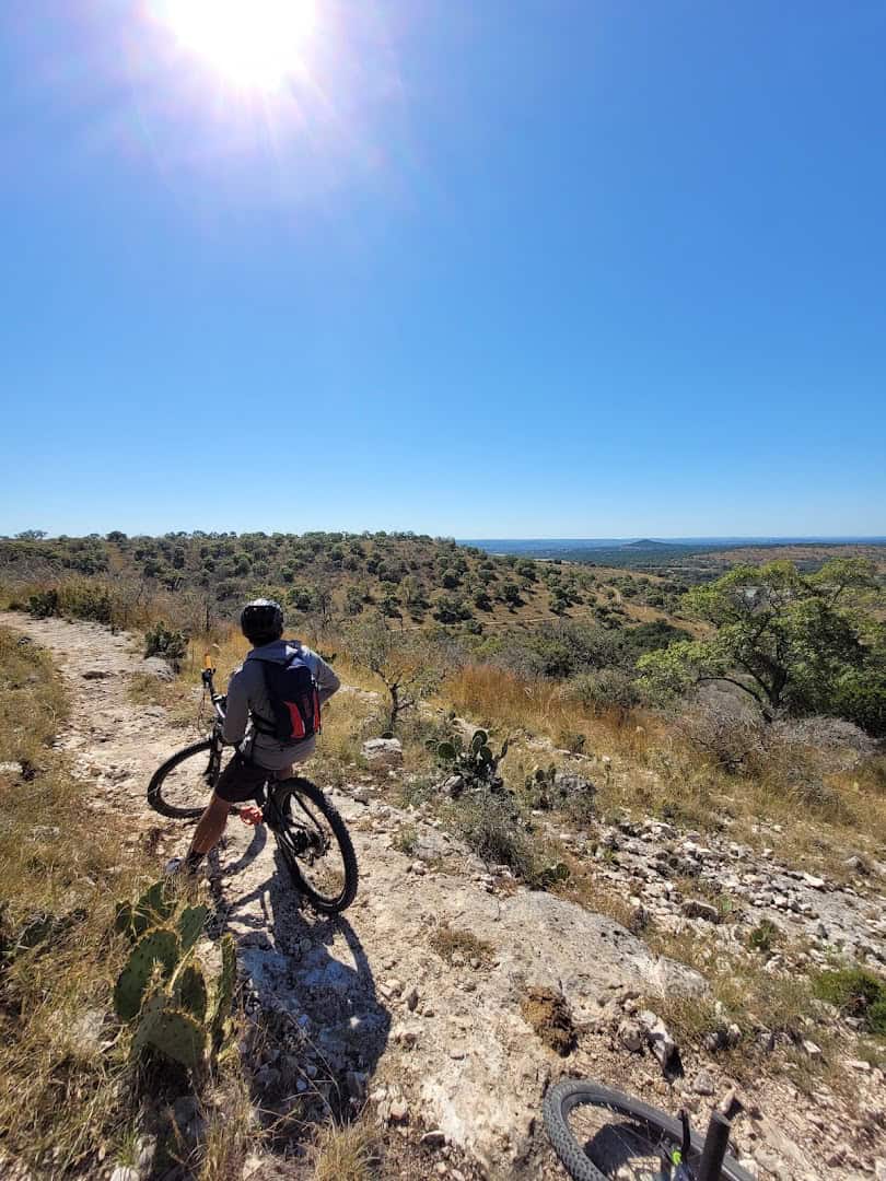 Mountain biker heading out on a trail at Flat Rock Ranch in the Texas Hill Country
