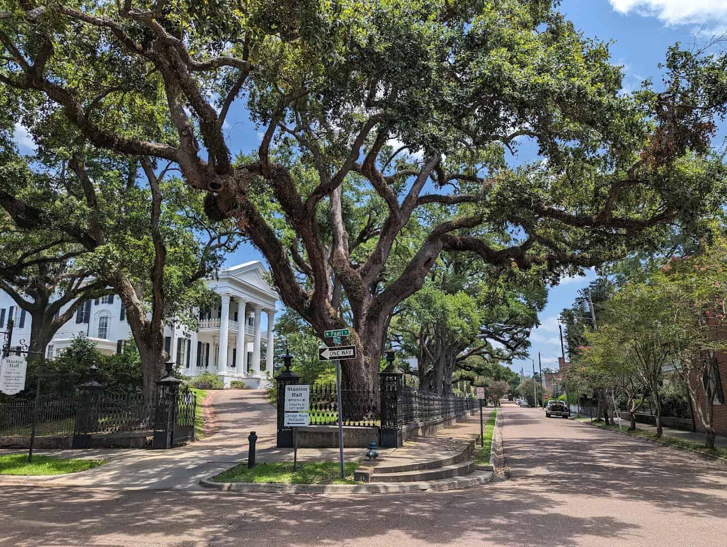 Oak-lined historic street and antebellum home in Natchez, Mississippi