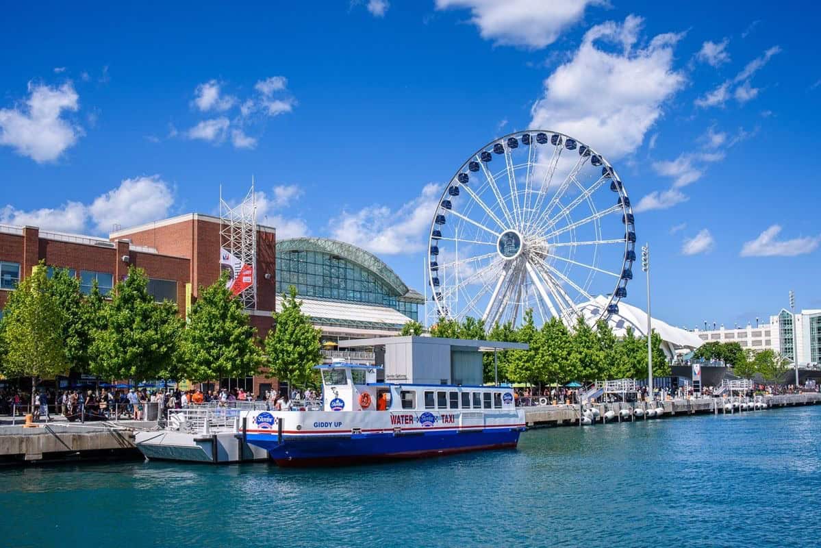 The Ferris wheel and boats at Navy Pier in Chicago, Illinois