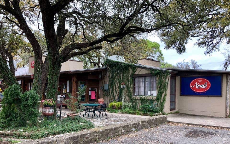 Neal's Lodges building and sign on the Frio River in Concan, Texas