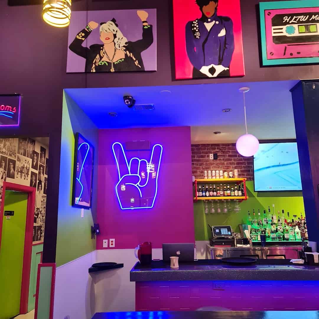 Neon-lit bar and wall art at Hungry Like The Wolf in Houston