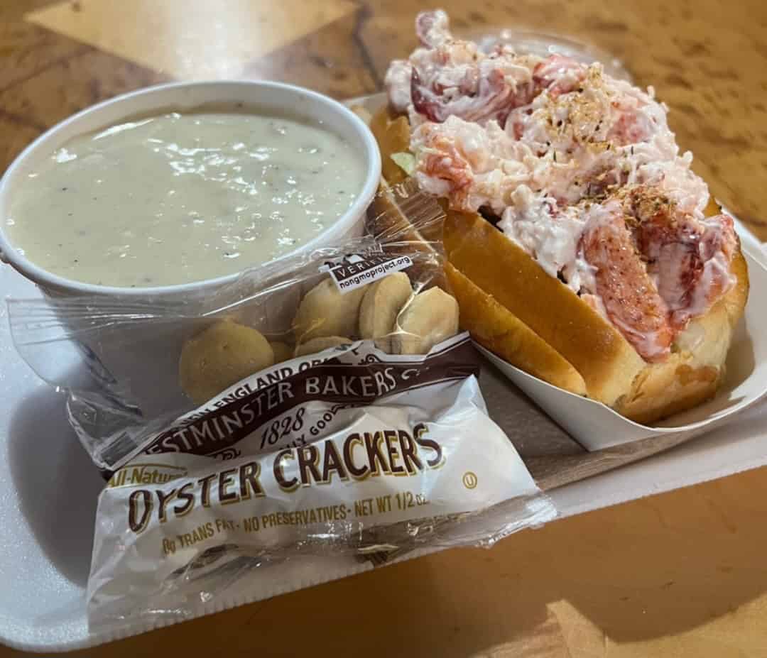 Cup of New England clam chowder with oyster crackers at Boston Chowda Co