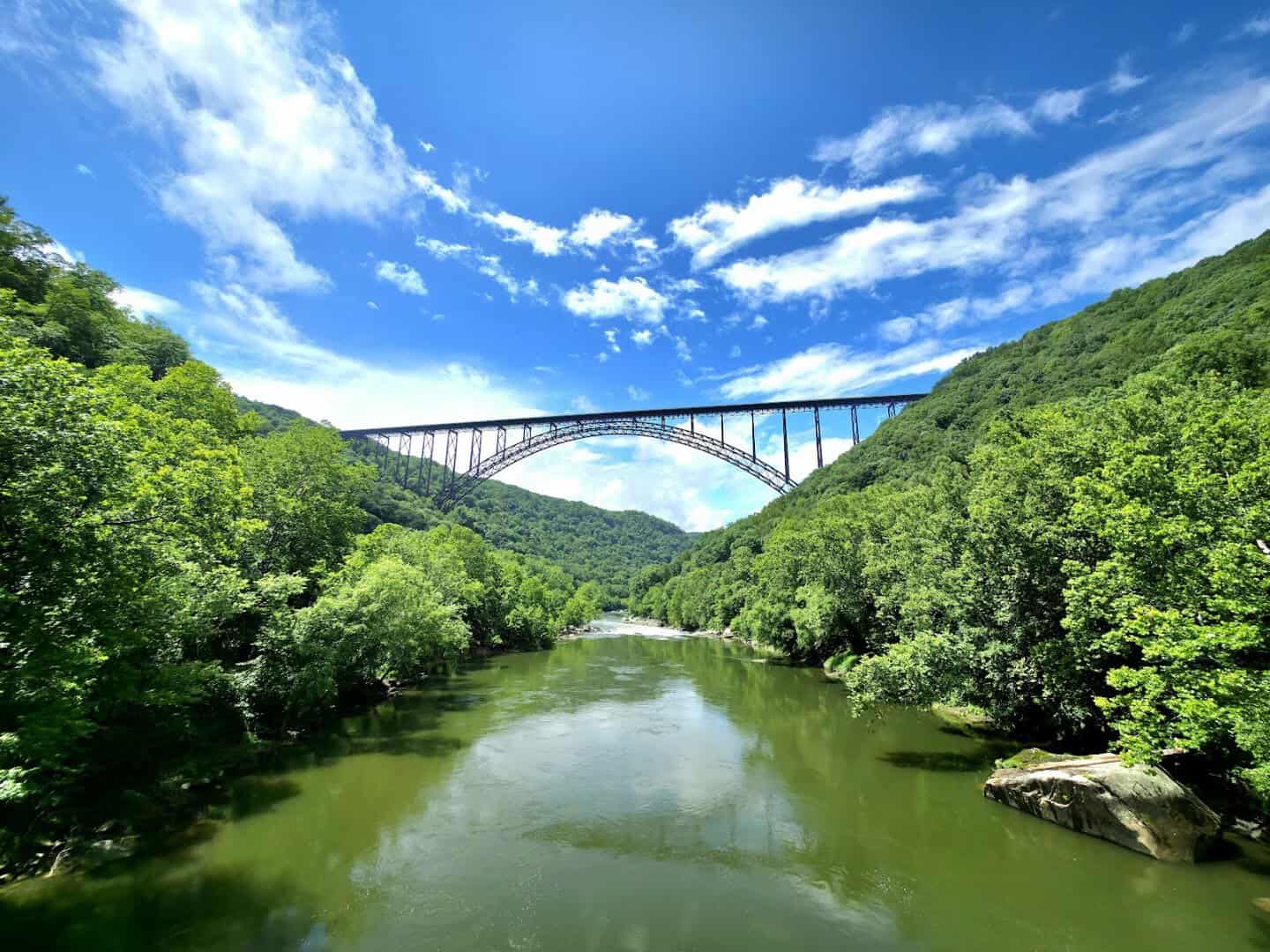 New River Gorge Bridge arching over the green gorge at New River Gorge National Park