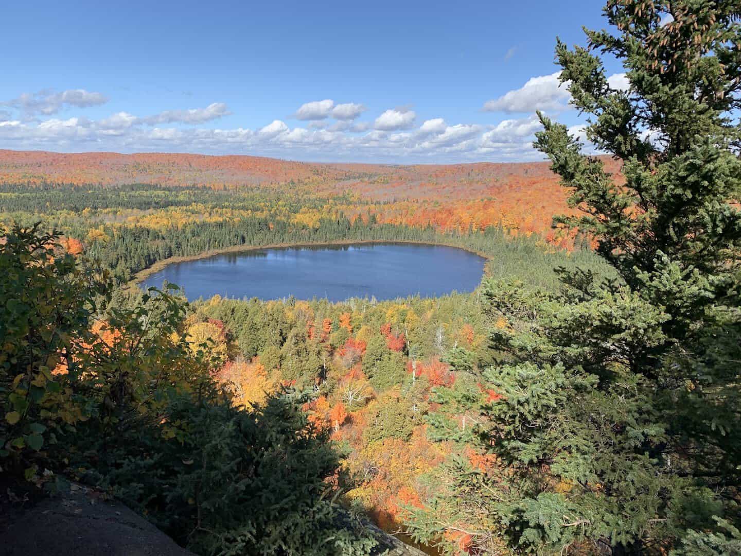 Lake ringed by brilliant autumn forest seen from Oberg Mountain on Minnesota's North Shore