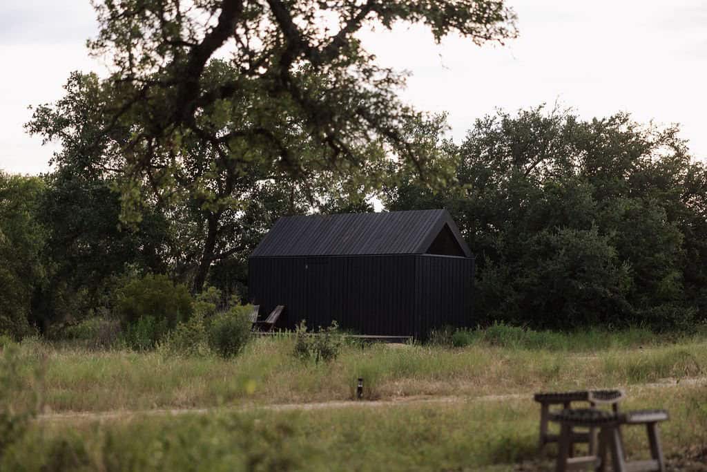 Off-grid black cabin in the Hill Country at NowHere, Round Mountain, Texas