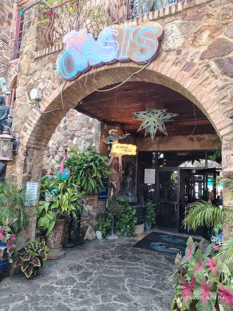 The Oasis on Lake Travis stone entrance archway with its sign in Austin