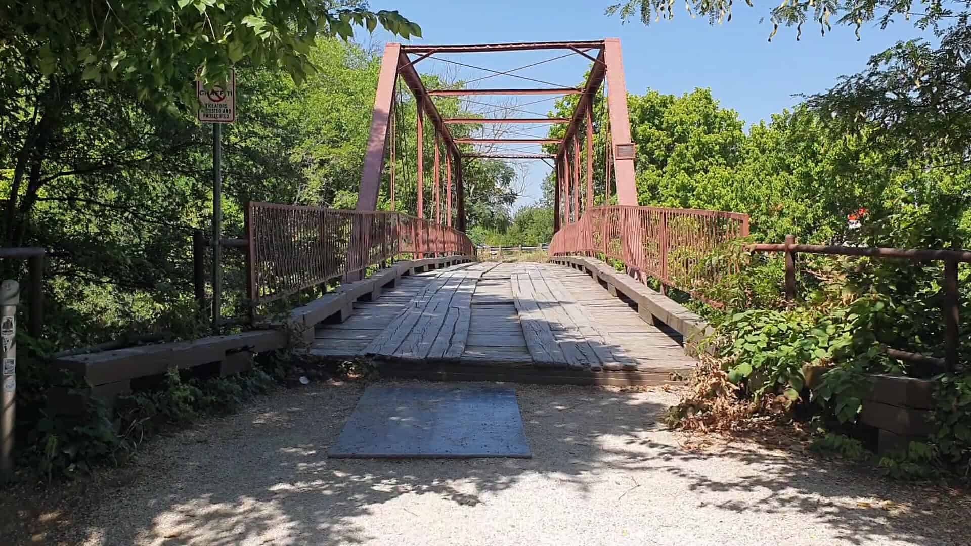 Old Alton Bridge, the Goatman's Bridge, iron truss and plank deck in Denton, Texas