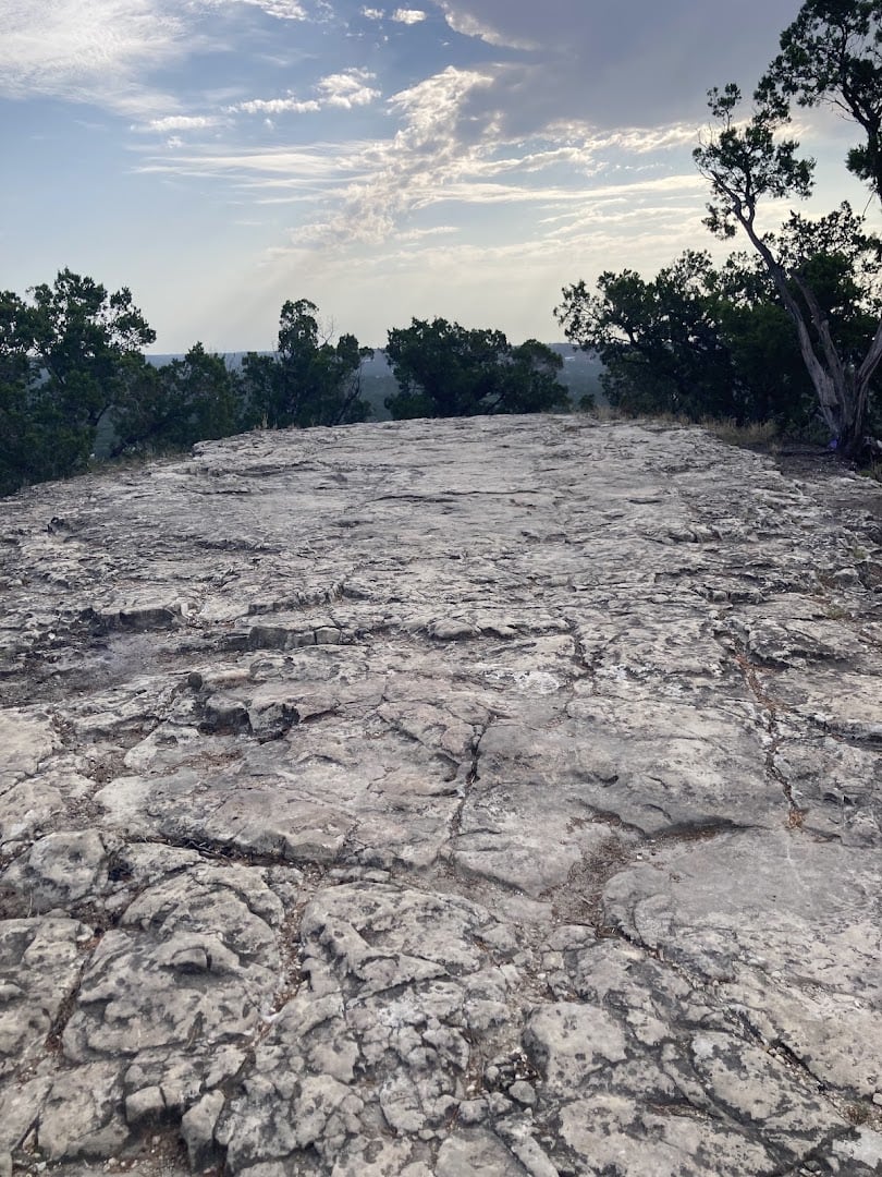 The wide bald rock summit clearing at the top of Old Baldy in Wimberley