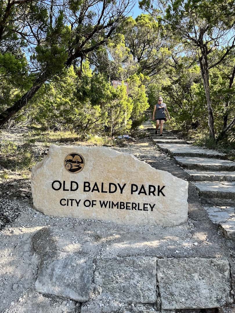 Old Baldy Park stone sign, City of Wimberley, at the base of the steps