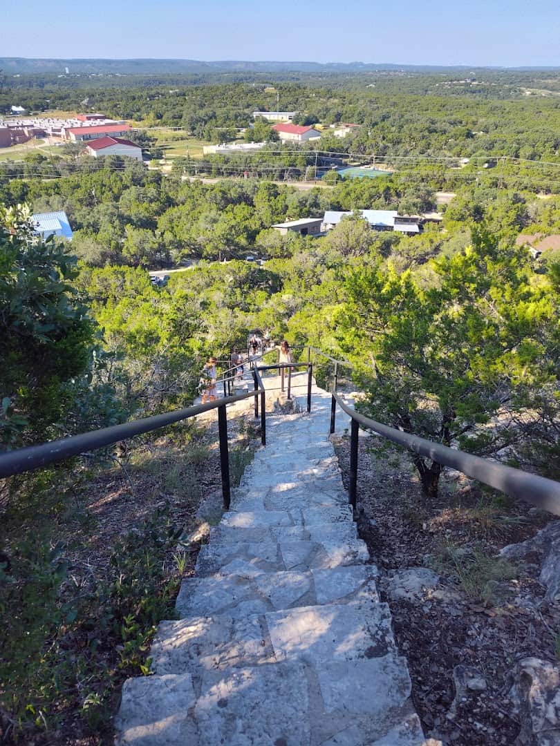 Looking down the Old Baldy steps toward the rooftops of Wimberley, Texas