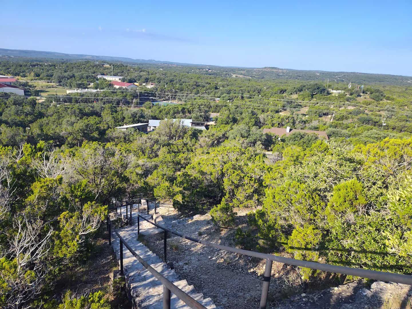 Sweeping view of the green Wimberley valley from the top of Old Baldy