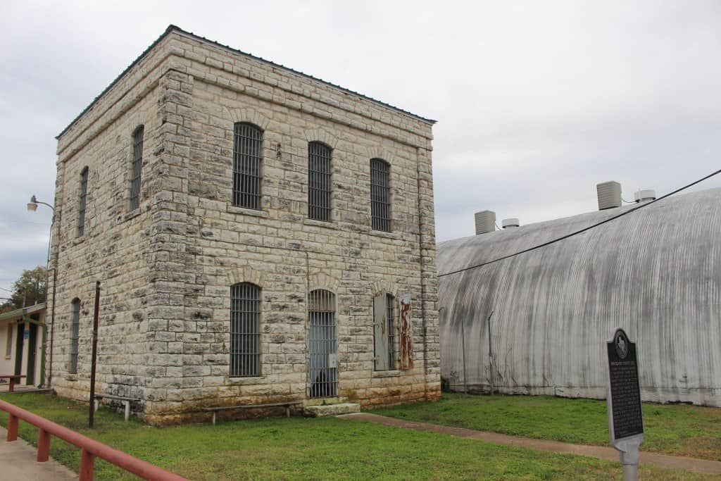 The historic limestone Blanco County jail building in Johnson City, Texas