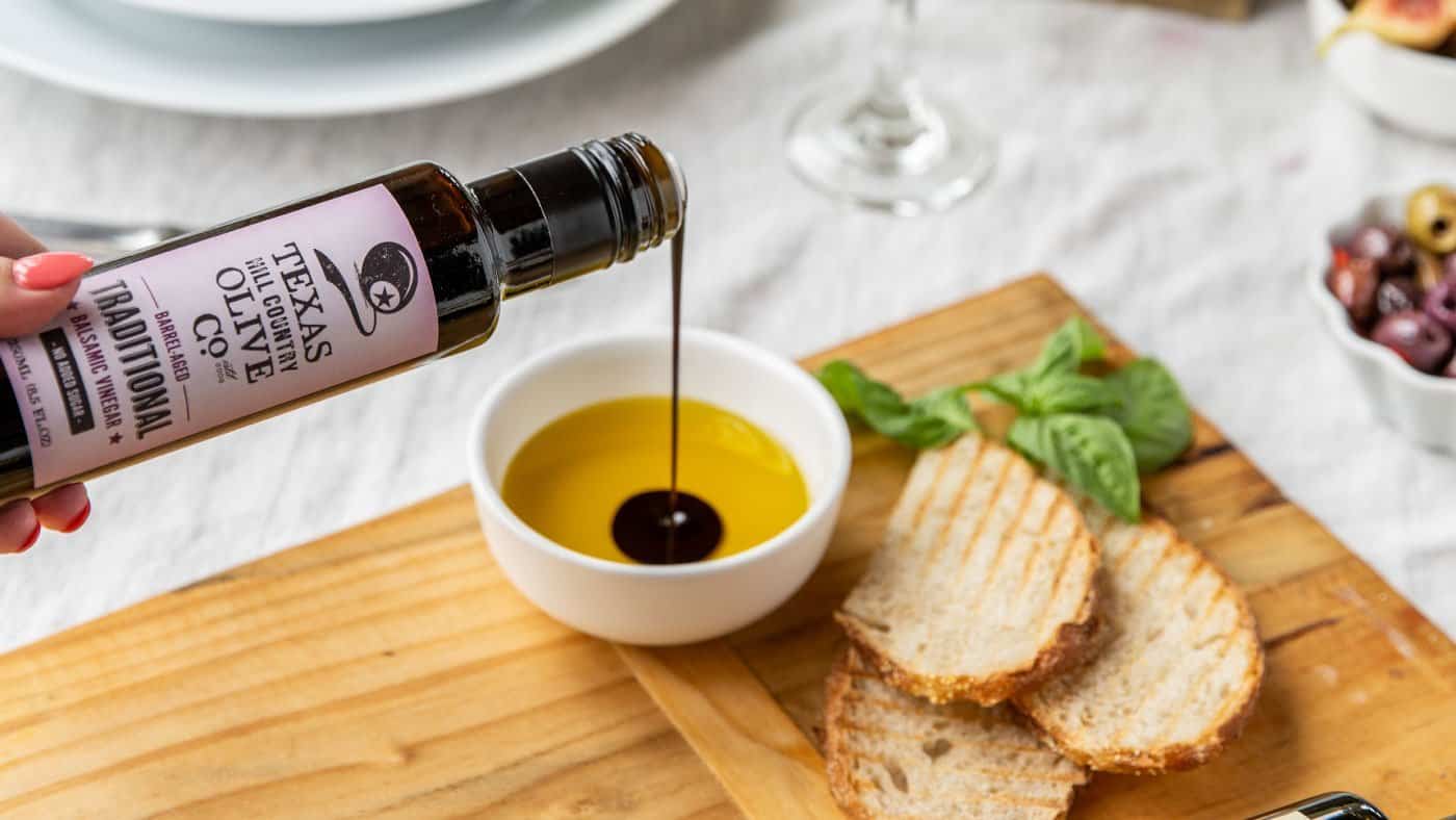 Texas Hill Country olive oil and balsamic vinegar poured over bread for a tasting