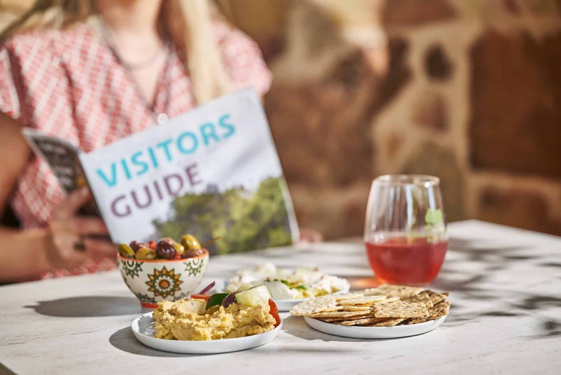 Olives, dips and wine on a tasting table at Texas Hill Country Olive Co.