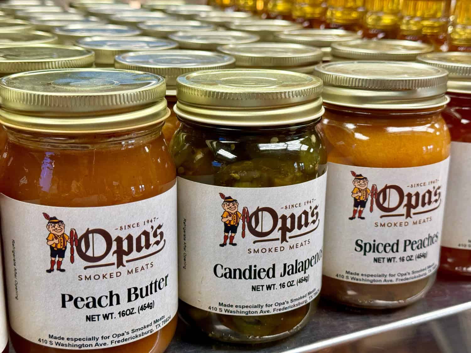 Jars of peach butter and candied jalapenos at Opa's Smoked Meats specialty market in Fredericksburg, Texas