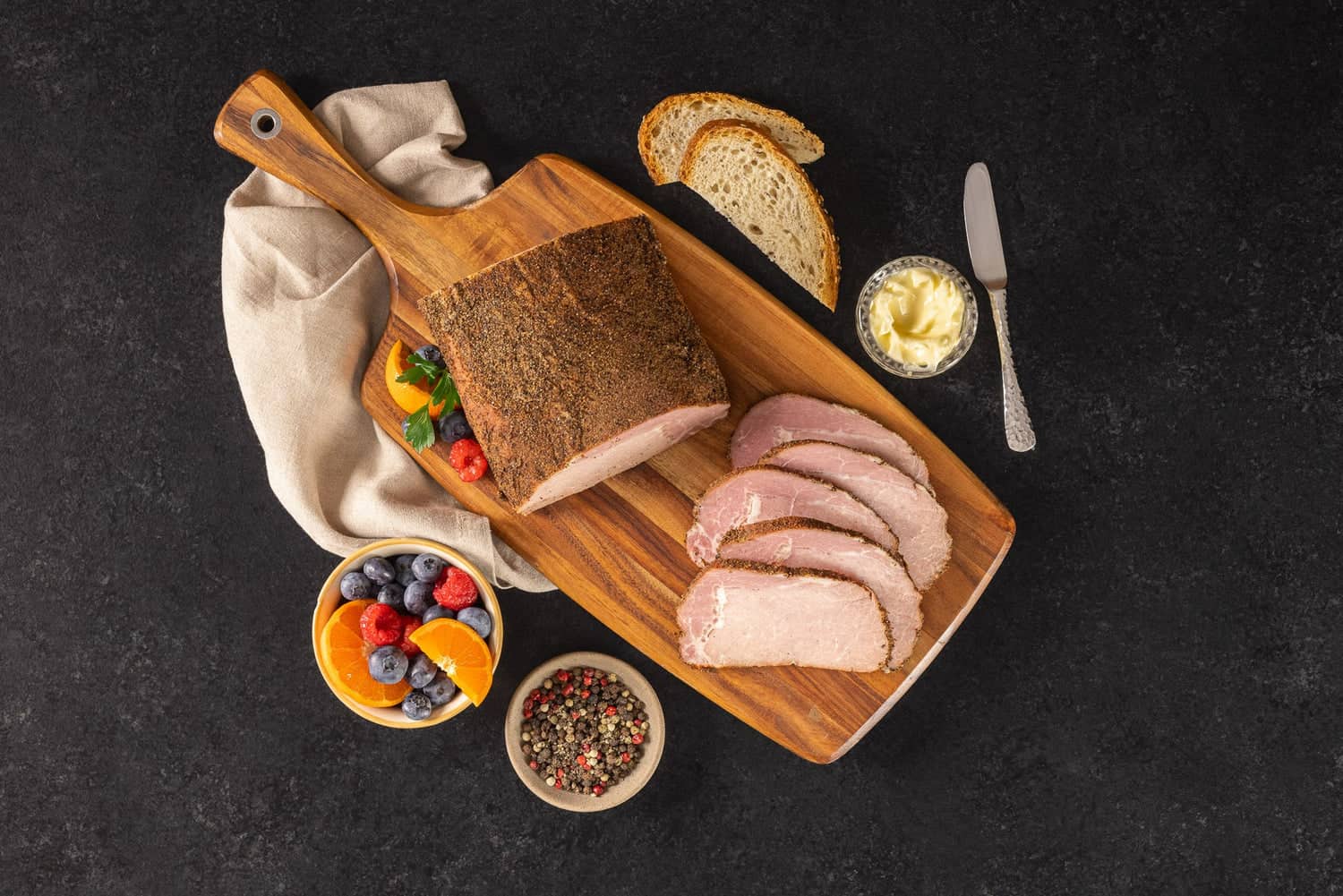 Sliced smoked tenderloin and summer sausage board at Opa's Smoked Meats in Fredericksburg, Texas