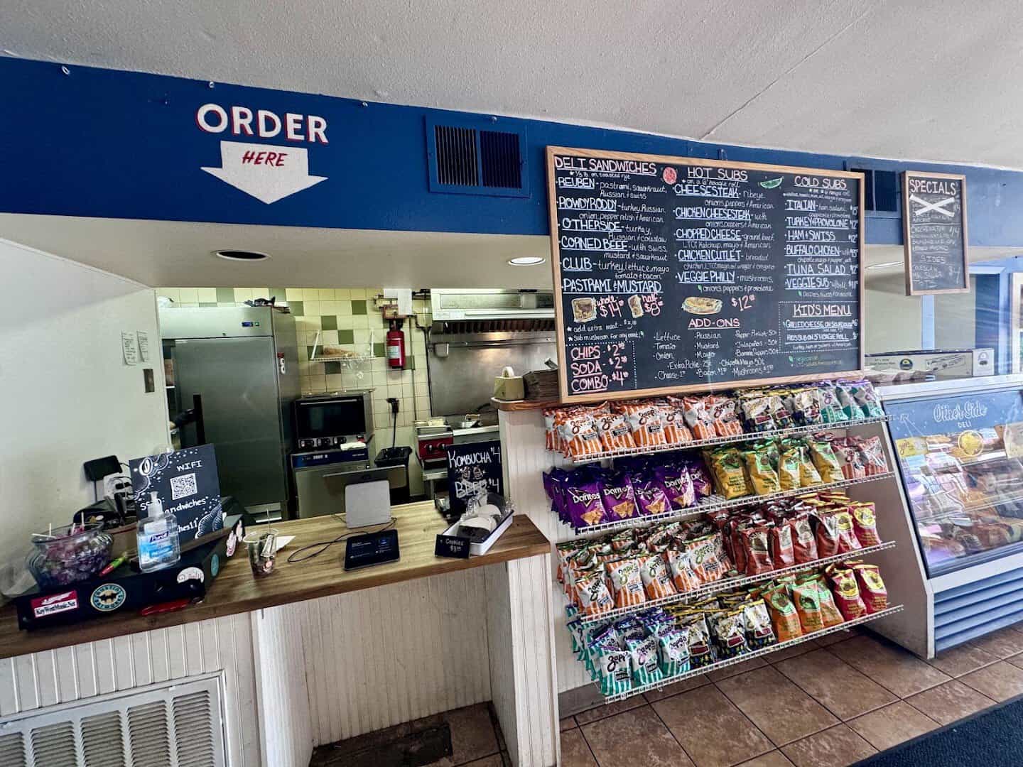 Order counter and menu board at Otherside Deli in Austin