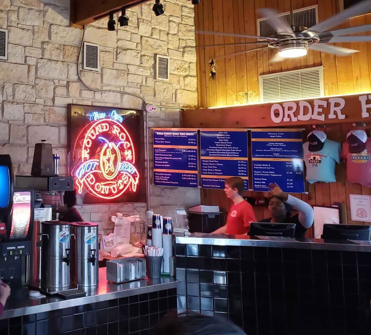 Order counter and menu boards inside Round Rock Donuts in Round Rock, Texas
